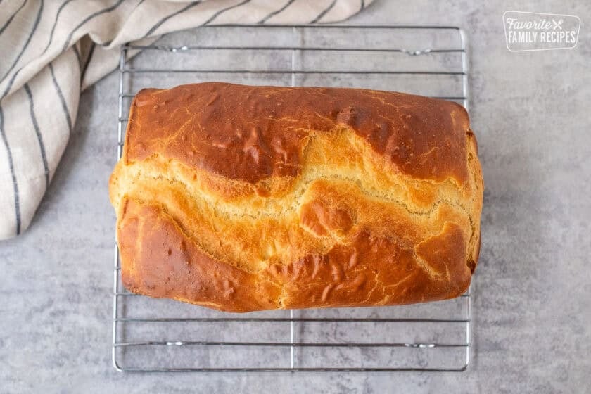 Baked Sally Lunn Bread cooling on a rack.
