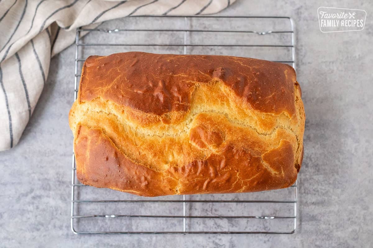 Baked Sally Lunn Bread cooling on a rack.