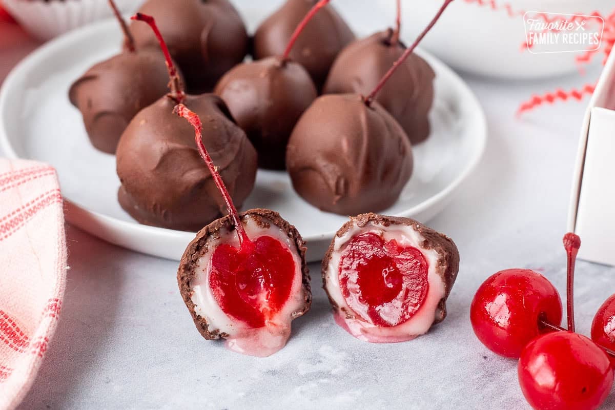 Close up of oozing chocolate covered cherry cut in half.