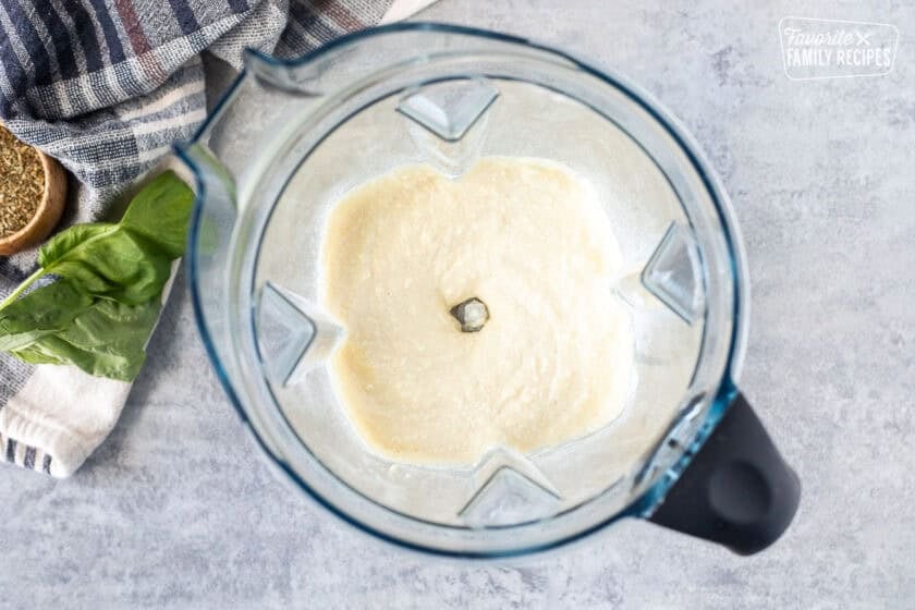 Blender with blended up cottage cheese pizza dough.