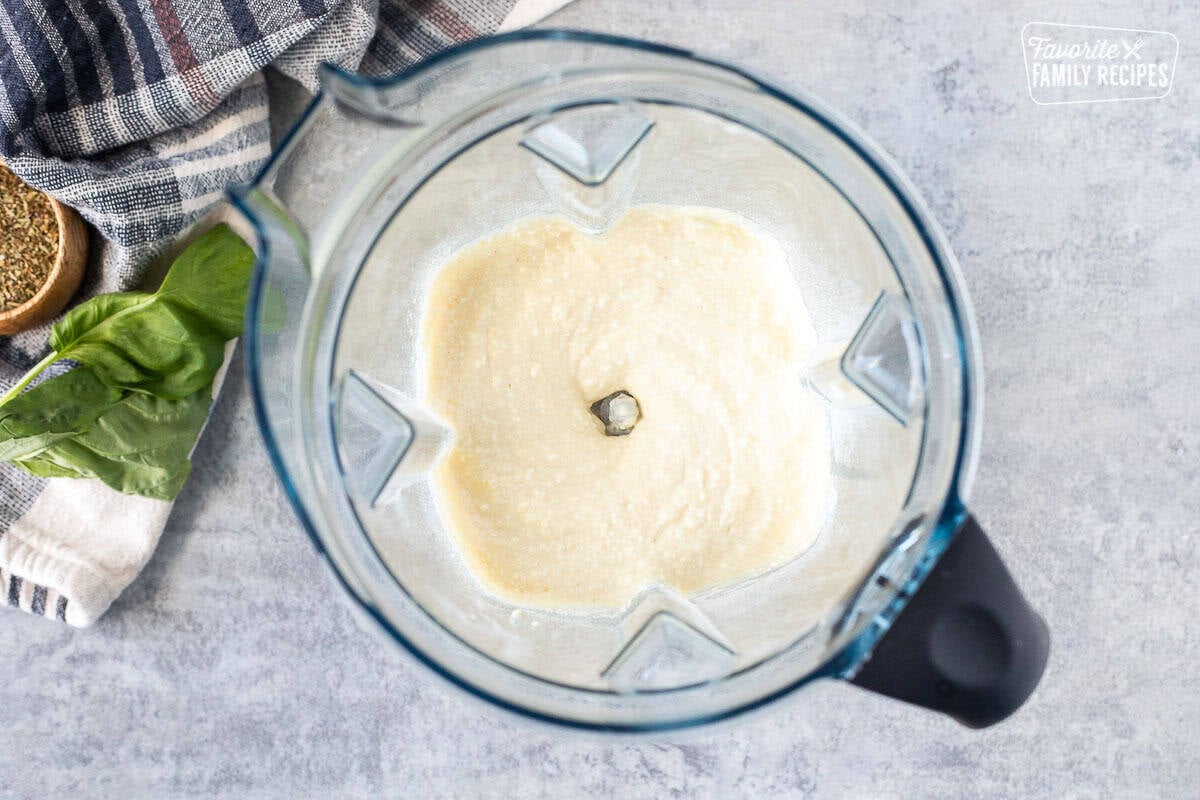 Blender with blended up cottage cheese pizza dough.