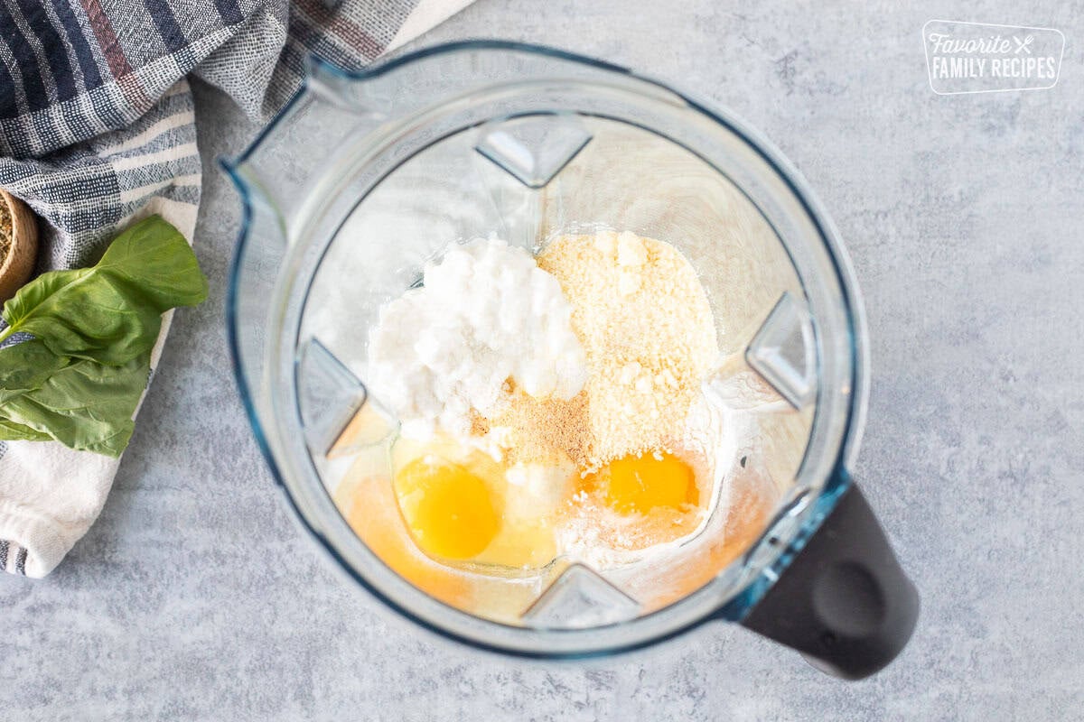 Blender with cottage cheese, grated Parmesan cheese, eggs and garlic powder.