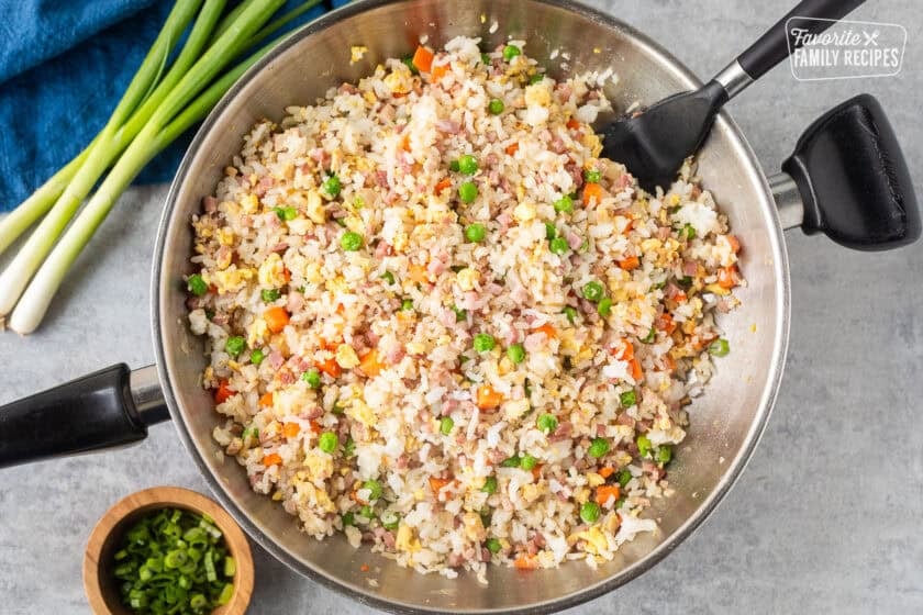 Skillet of Ham Fried Rice with spatula.