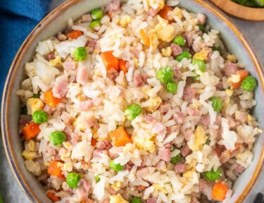 Bowl of Ham Fried Rice with ham, egg, peas and carrots.