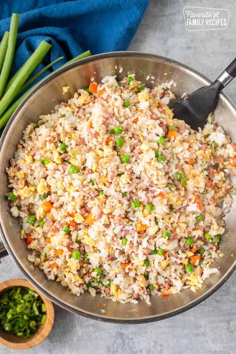 Skillet of Ham Fried Rice with spatula.