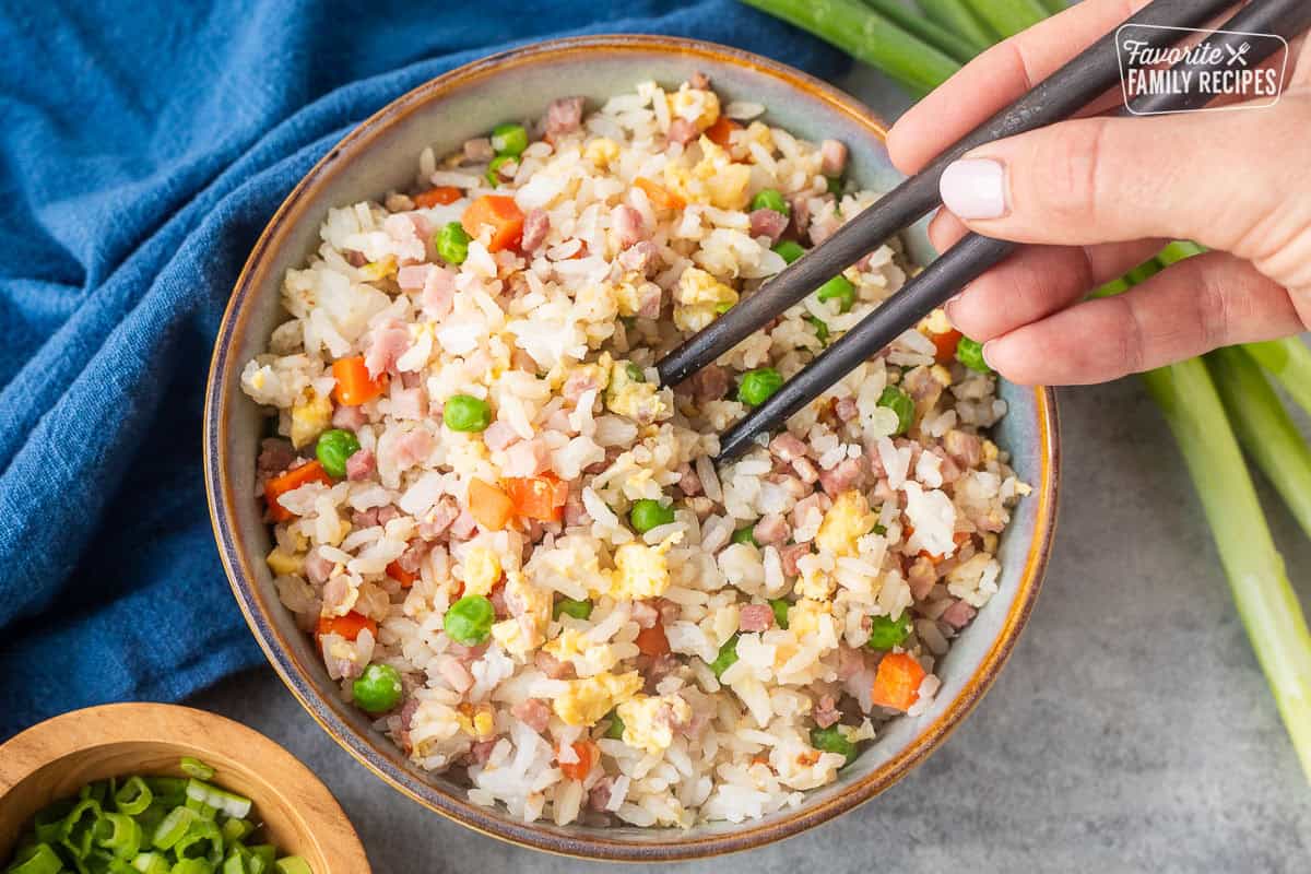 Chopsticks over bowl of Ham Fried Rice.