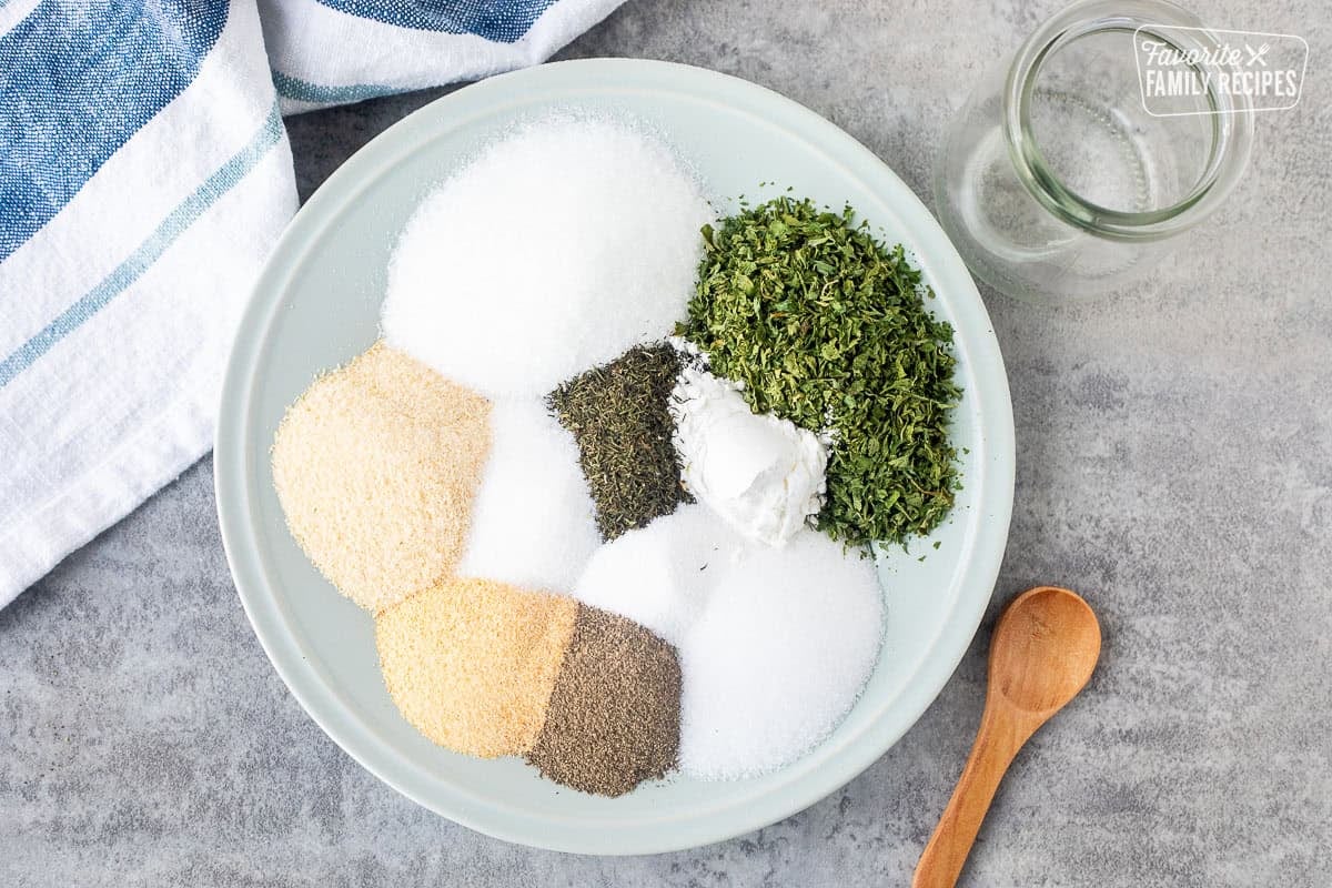 Dish with onion powder, garlic powder, parsley flakes, citric acid, MSG accent, cornstarch, salt, pepper, sugar and dill.