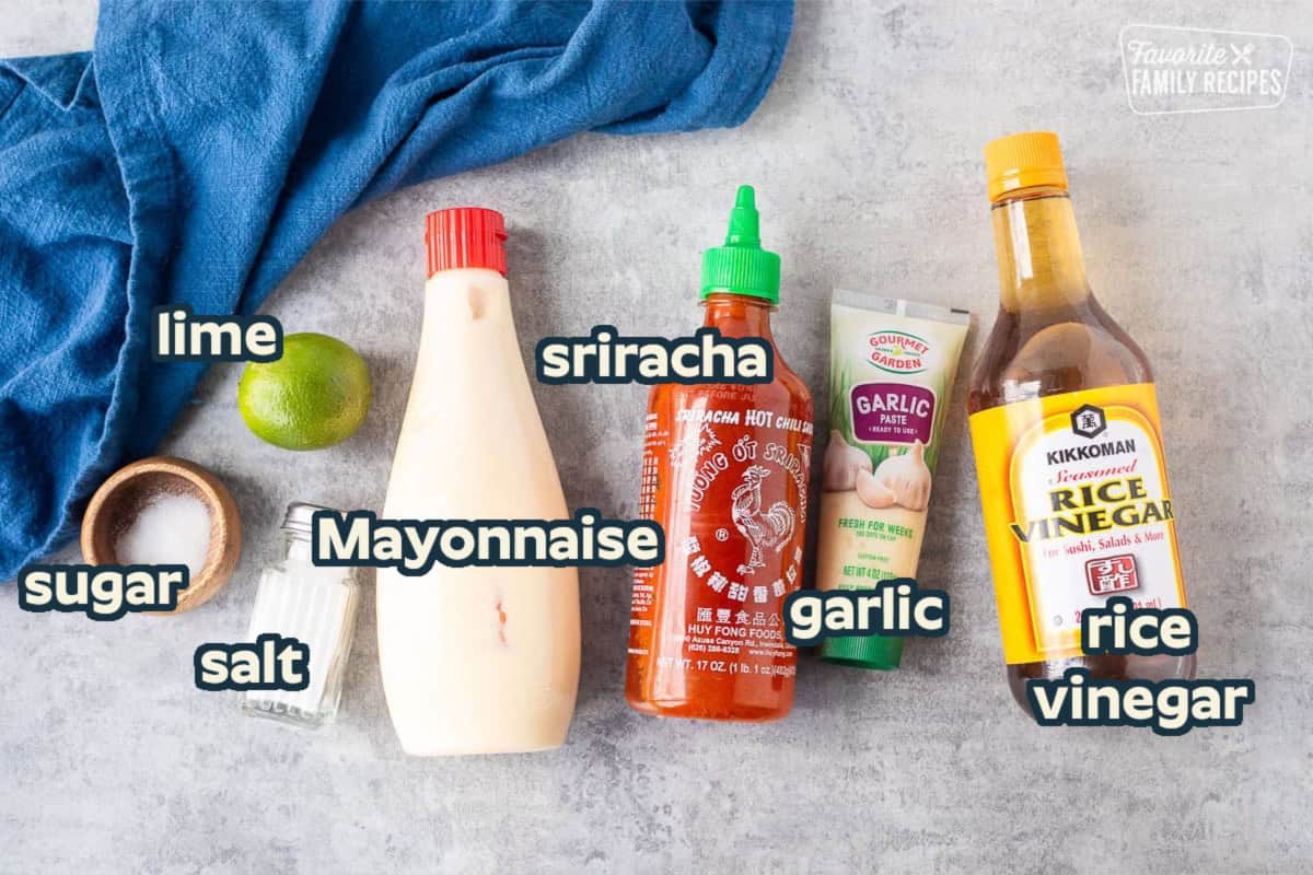 Ingredients to make easy sriracha mayo including Japanese mayo, sriracha hot chili sauce, garlic paste, rice vinegar, salt, sugar and lime juice.