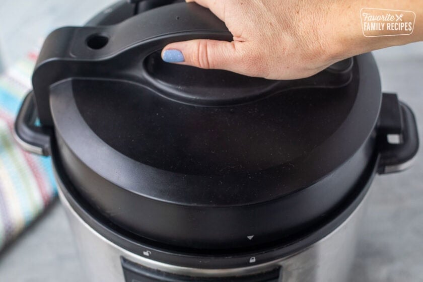 Sealing lid on instant pot.