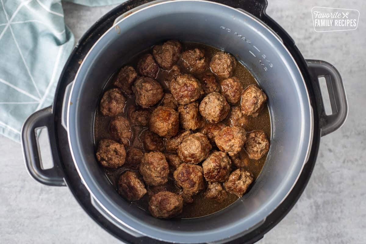 Combining Swedish meatballs with broth in an instant pot.