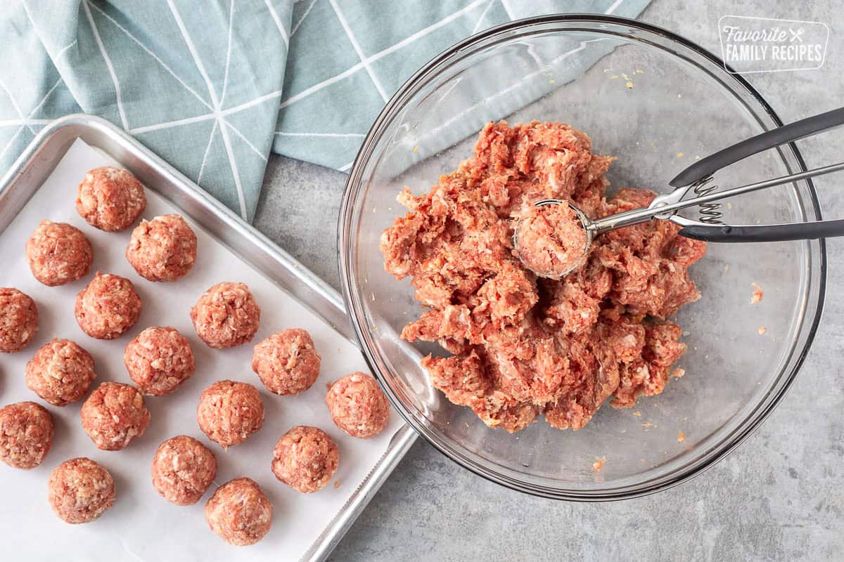 Scooping Swedish meatball mixture and shaping into balls.