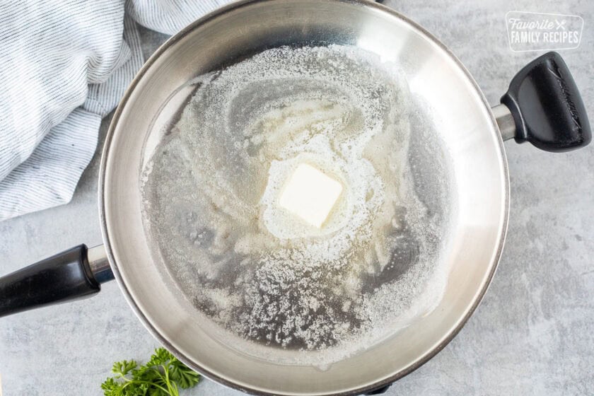 Skillet with melted butter.