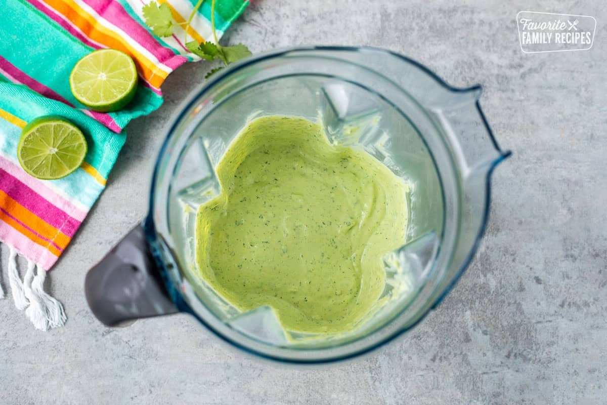 Blender with avocado cilantro lime sauce.