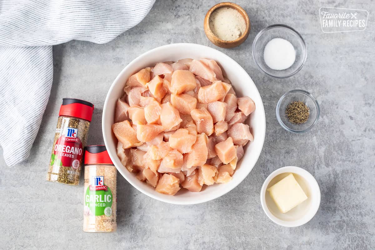 Ingredients to make diced chicken including diced chicken, oregano, garlic minced, ranch dressing mix, salt, pepper and butter.