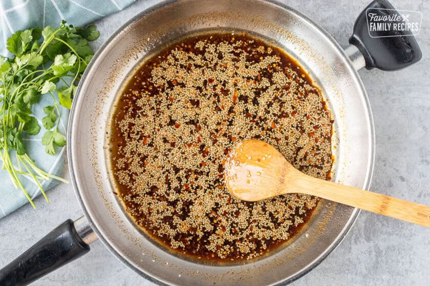 Skillet with sweet and spicy sauce base for noodles.