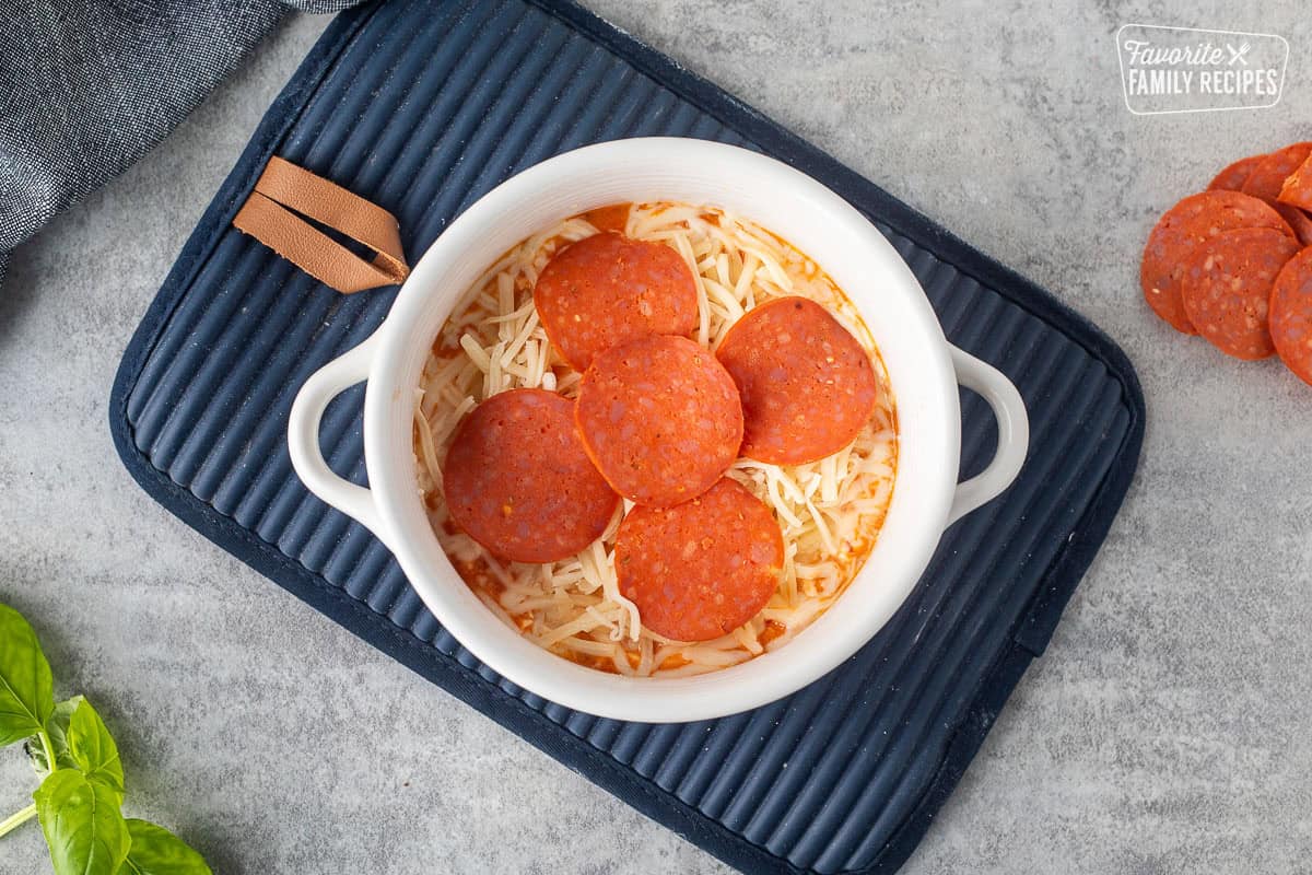 Mozzarella cheese and turkey pepperoni. topped on baked bowl with cottage cheese mixture.