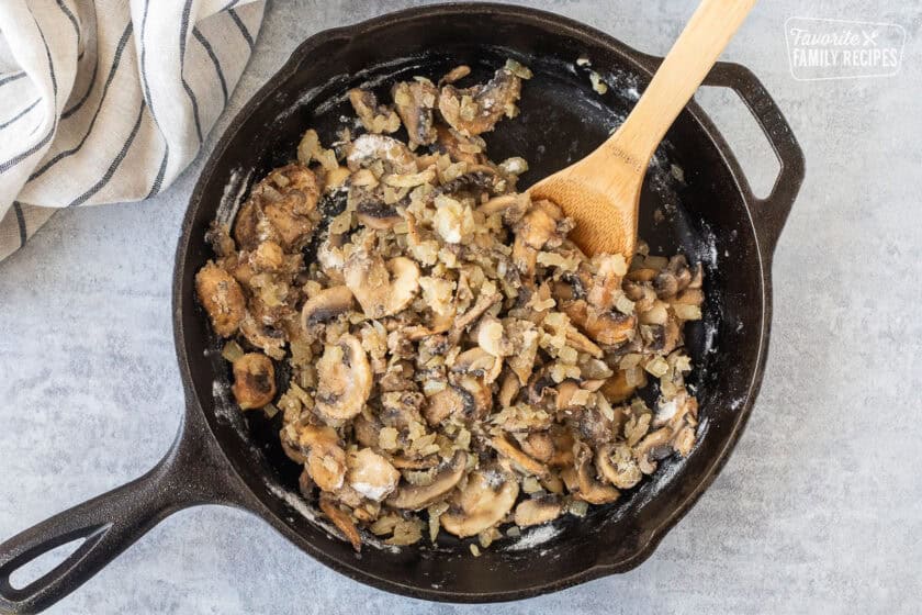 Skillet with sautéed mushrooms and onions with flour.
