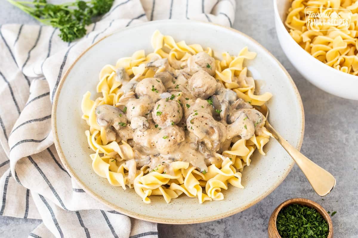 Plate of Creamy Meatball Stroganoff over noodles.