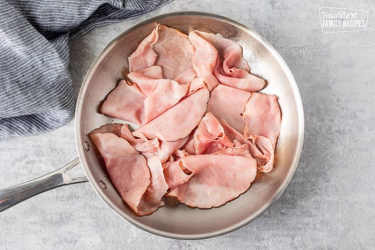 Skillet with heated ham.
