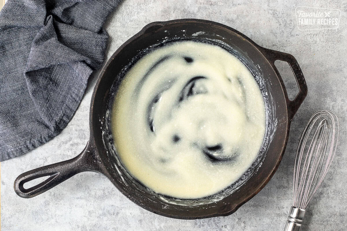 A simple white roux in a skillet made from butter and cornstarch to make mac and cheese