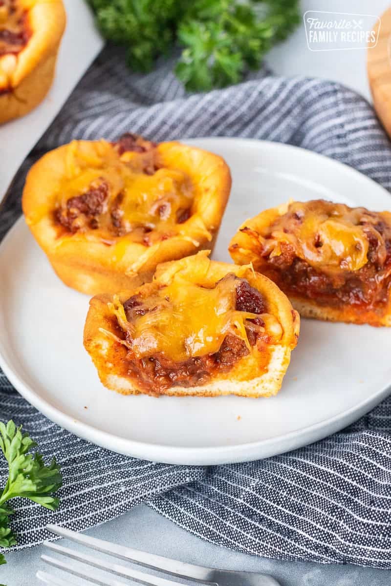 Sloppy Joe Biscuits cut in half on a plate.