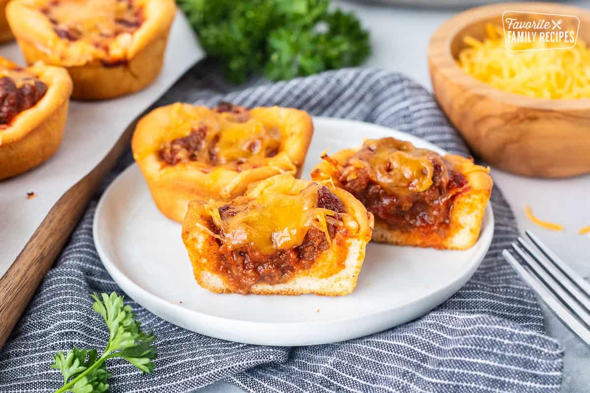 Sloppy Joe Biscuits cut in half on a plate.