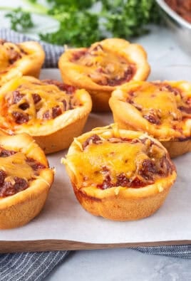 Sloppy Joe Biscuits sprinkled with cheddar cheese.