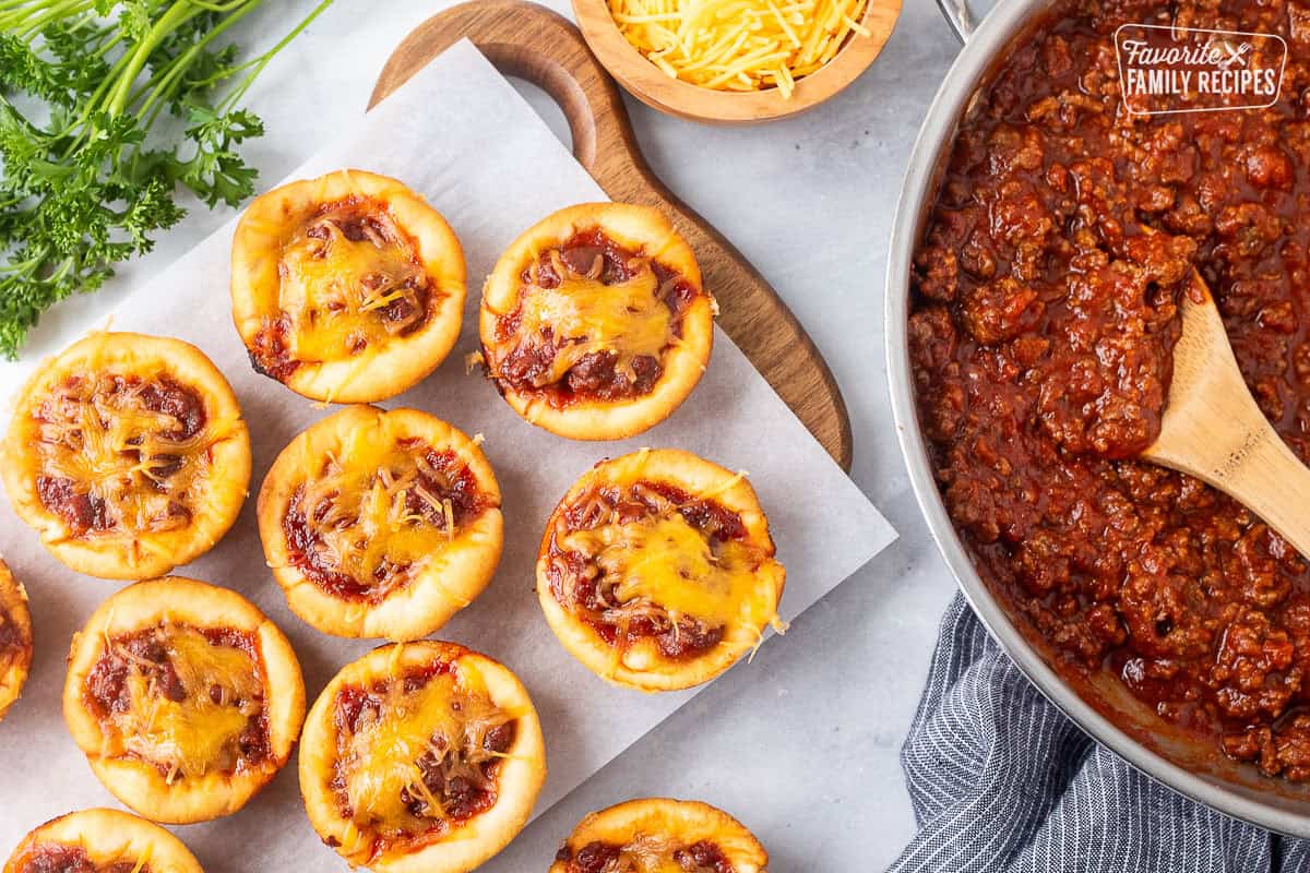 Sloppy Joe Biscuits sprinkled with cheddar cheese.