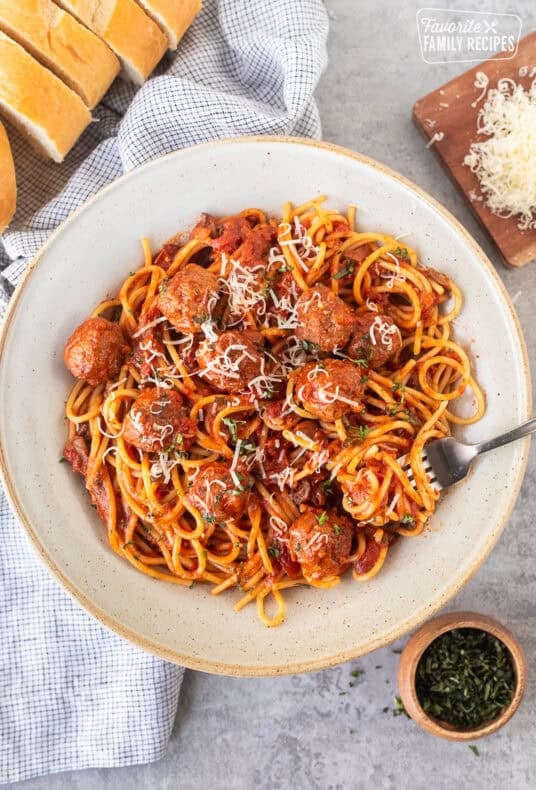 Spaghetti and meatballs stirred with pasta.