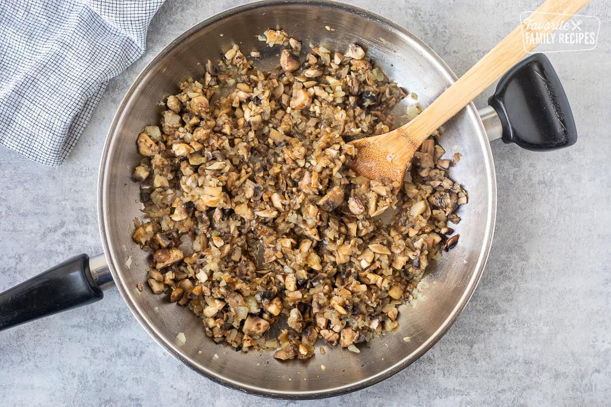 Skillet with sautéed onions and mushrooms.