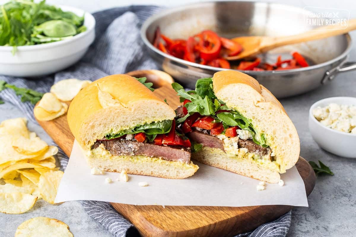 Steak Sandwich on a French roll cut in half.