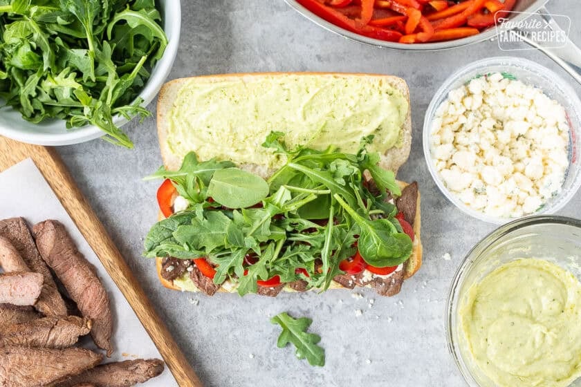 French roll with pesto mayo, steak, blue cheese, red peppers and arugula mix.