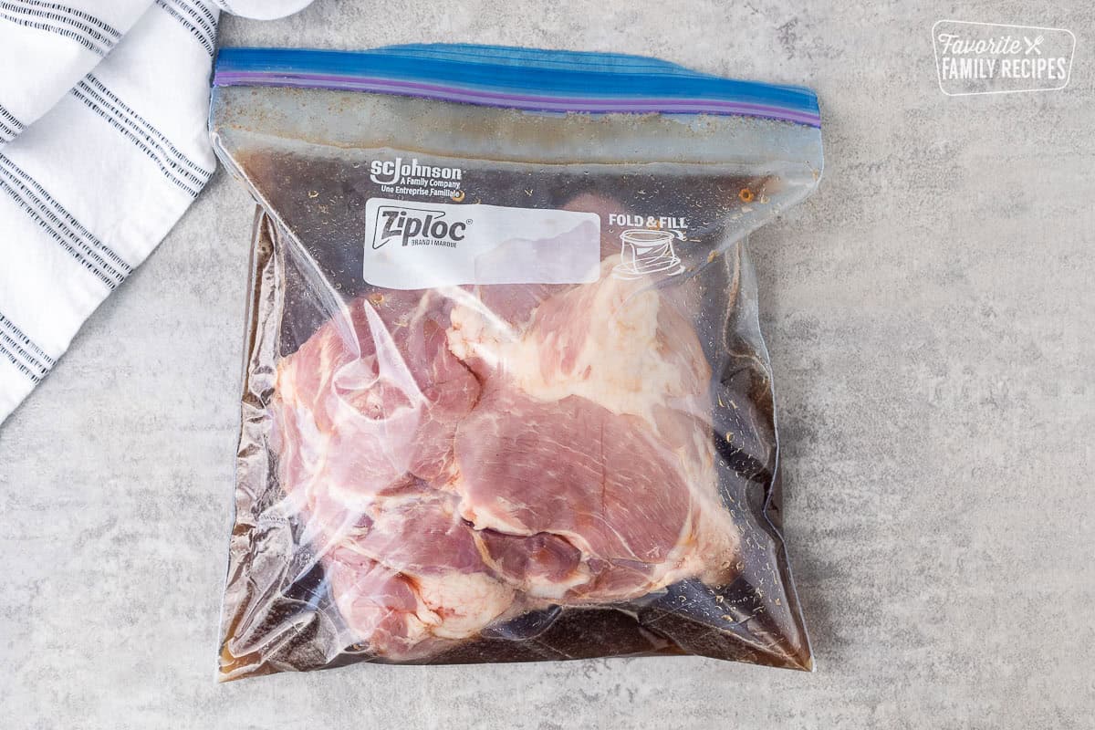 Ziplock bag with pork roast and marinade.