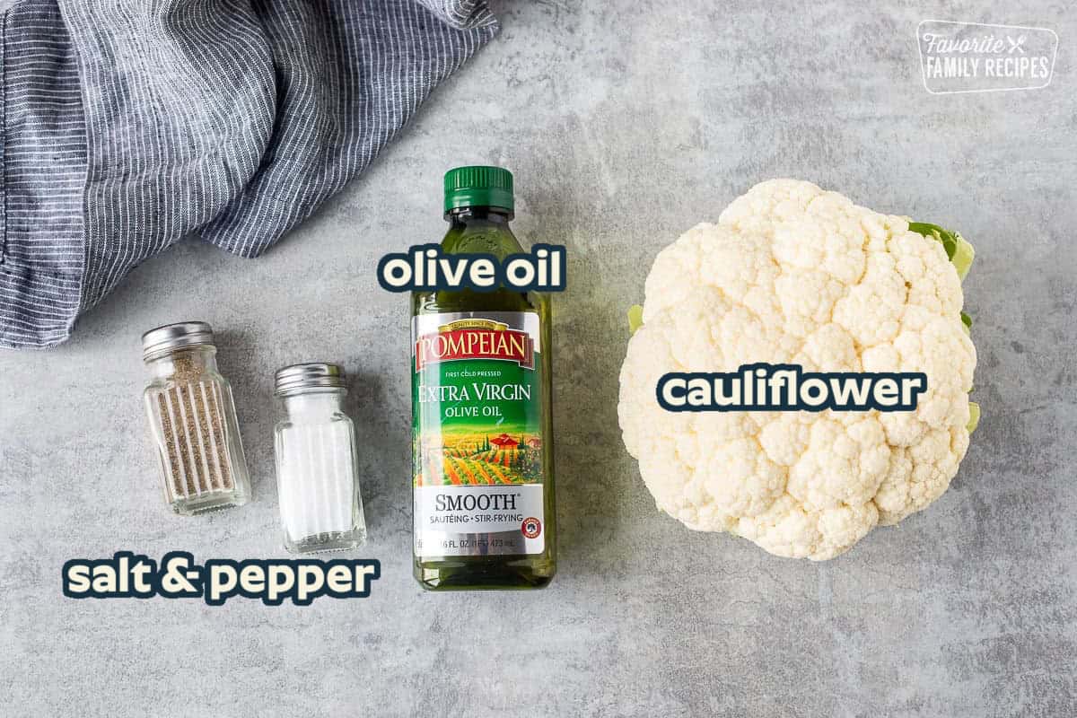 Ingredients to make cauliflower rice including cauliflower, olive oil, salt and pepper.