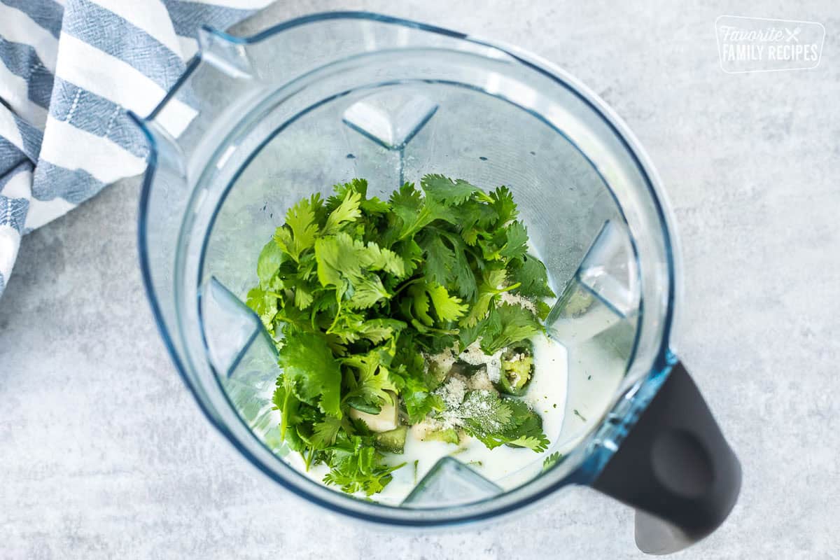 Blender with all ingredients for Cafe Rio Creamy Tomatillo Ranch Dressing in the blender.