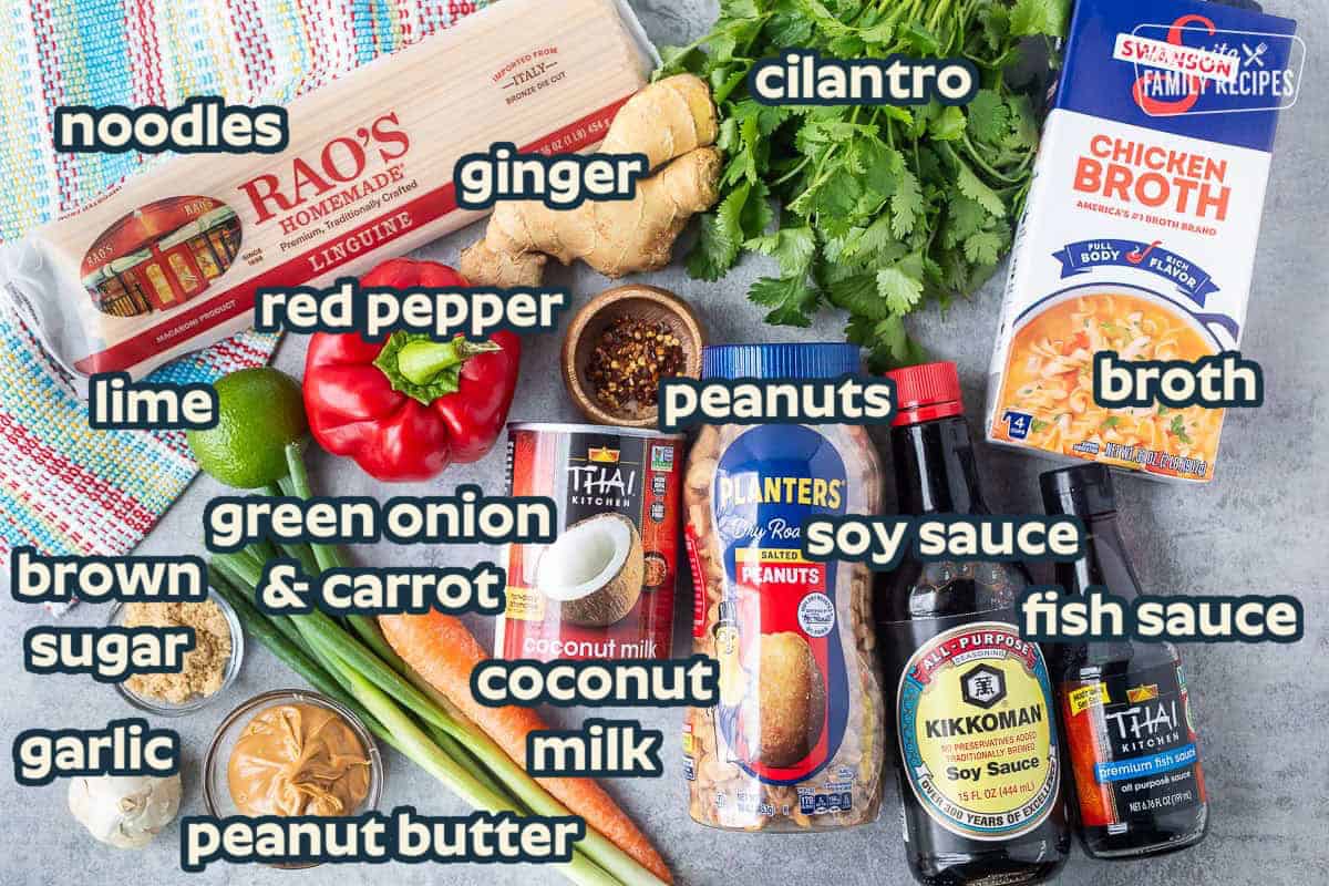 Ingredients to make One Pot Thai Noodles including chicken broth, fish sauce, soy sauce, peanuts, coconut milk, carrot, green onion, red bell pepper, lime, ginger, cilantro, linguine, peanut butter, brown sugar, and garlic.
