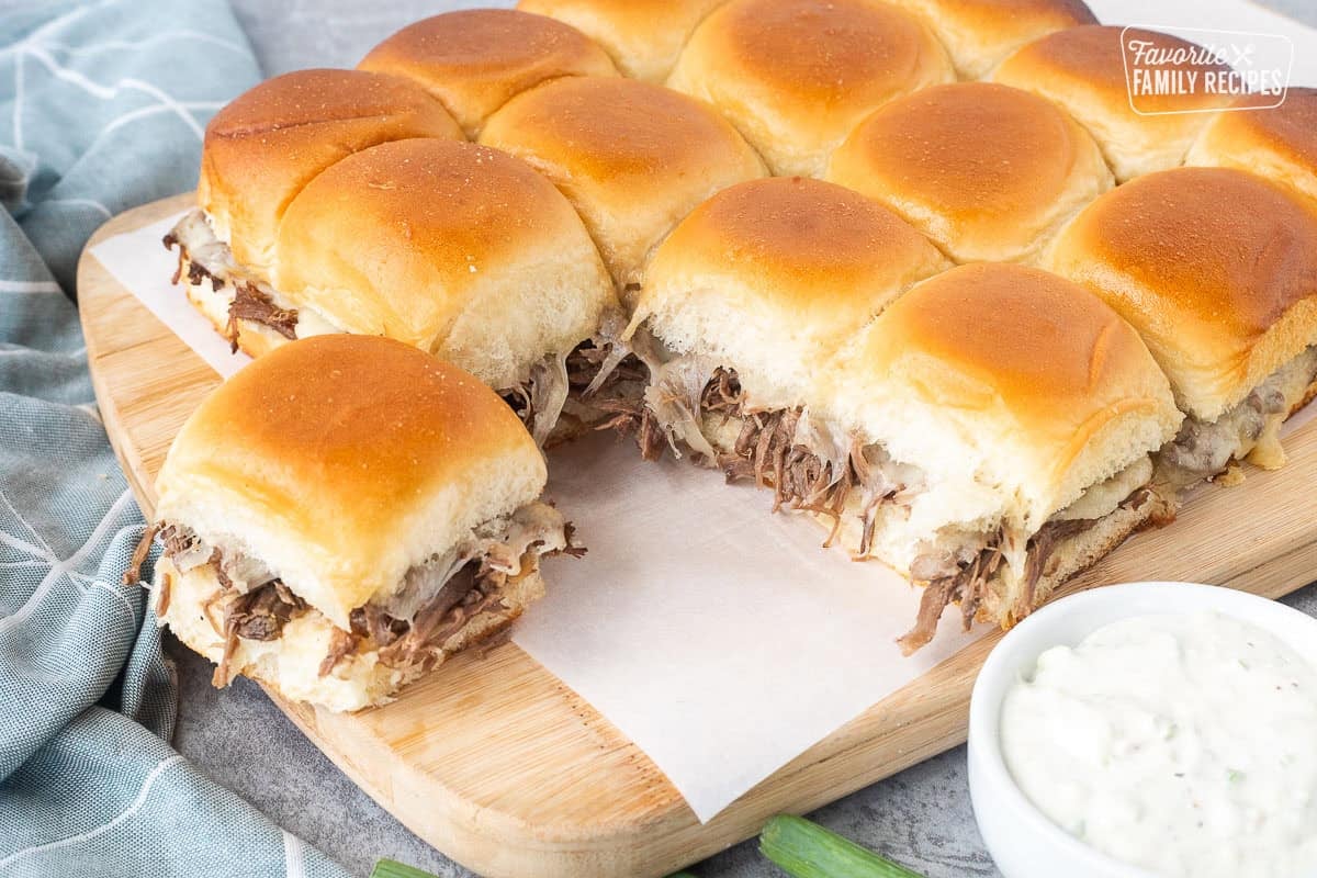 Roast beef and Swiss cheese sliders on Hawaiian rolls.