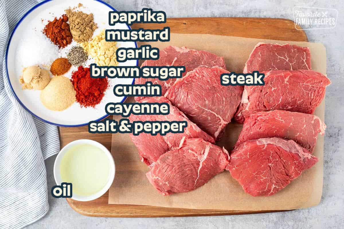 This steak rub recipe gives just the right amount of sweet and spicy flavor to a New York Steak. Add the rub, wait 4 hours, then grill to perfection! Ingredients to make Spice Rubbed Steak including steak, oil, garlic powder, salt, brown sugar, paprika, cumin, pepper, cayenne pepper, ground mustard and chili powder.