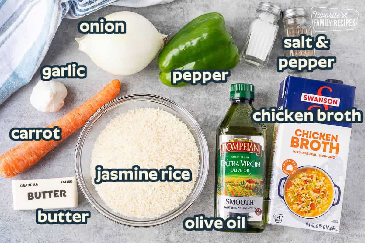 Ingredients to make Vegetable Rice including rice, garlic, carrot, green pepper, onion, olive oil, chicken broth, butter, salt and pepper.