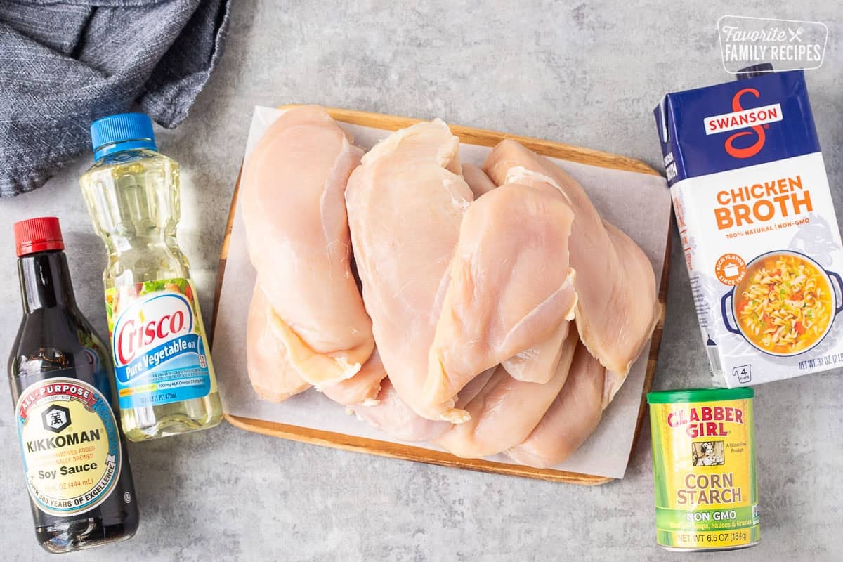 Ingredients to make velvet chicken including chicken, corn starch, chicken broth, soy sauce and vegetable oil.