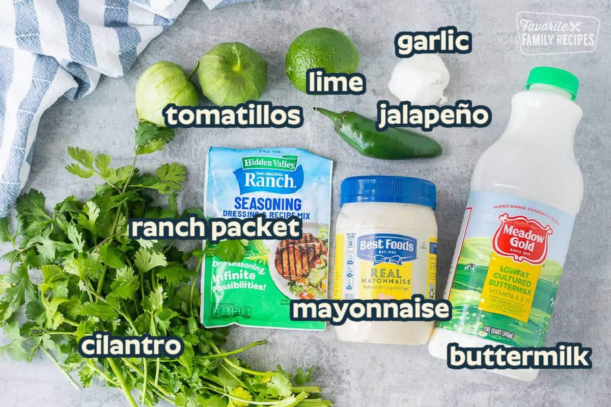 Ingredients to make Cafe Rio Creamy Tomatillo Ranch Dressing including buttermilk, mayonnaise, ranch dressing mix, cilantro, jalapeño, garlic, lime and tomatillos.