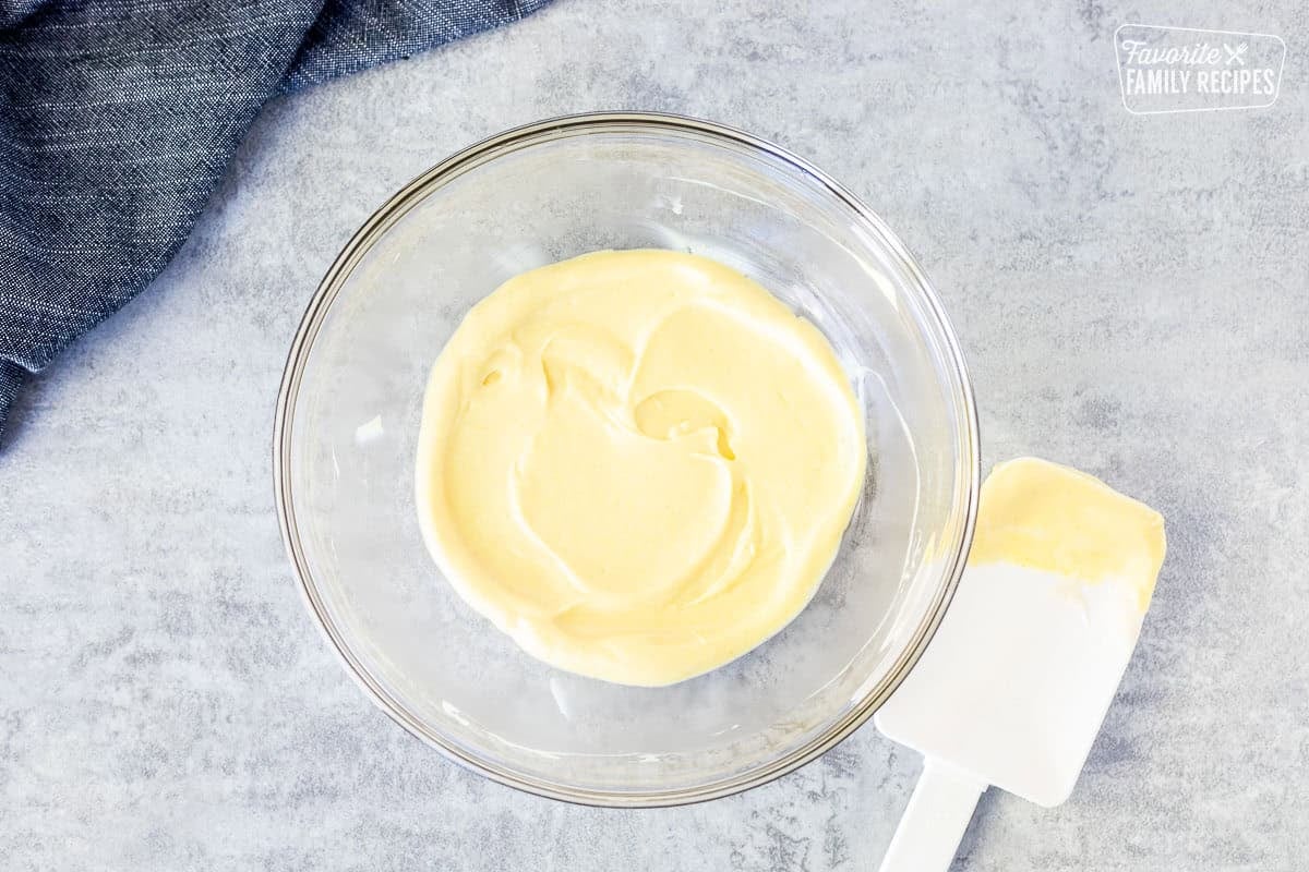Small glass bowl with combined sauce and spatula.