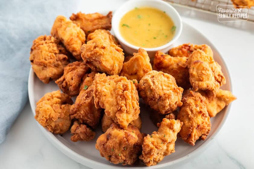 Mafa Chicken on a plate with dipping sauce.