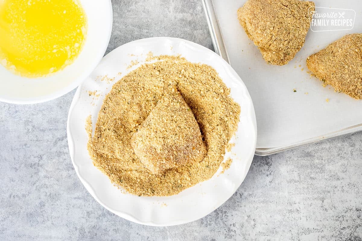 Chicken breast dipped in melted butter and covered in parmesan cheese mixture.