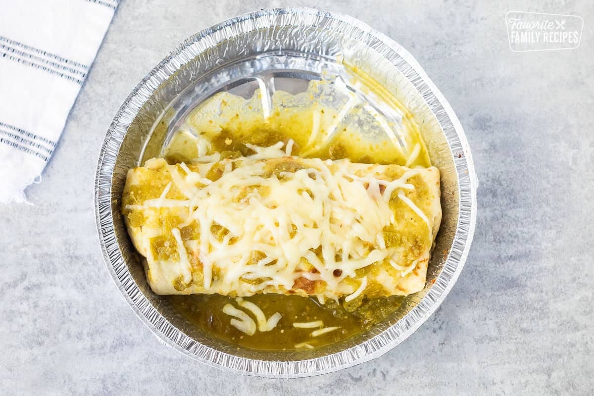 Melted cheese on top of sweet pork burrito.