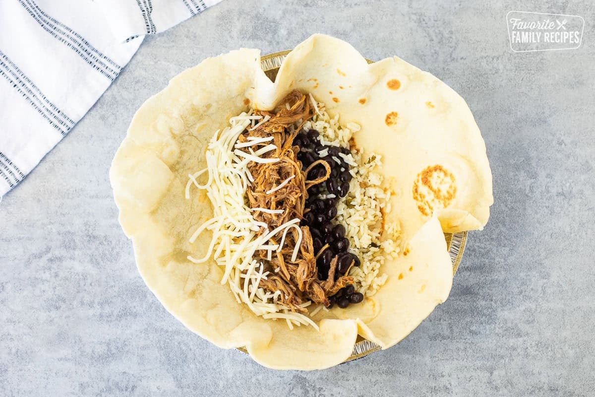 Large flour Tortilla with cilantro lime rice, black beans, sweet pork and Monterey Jack cheese.