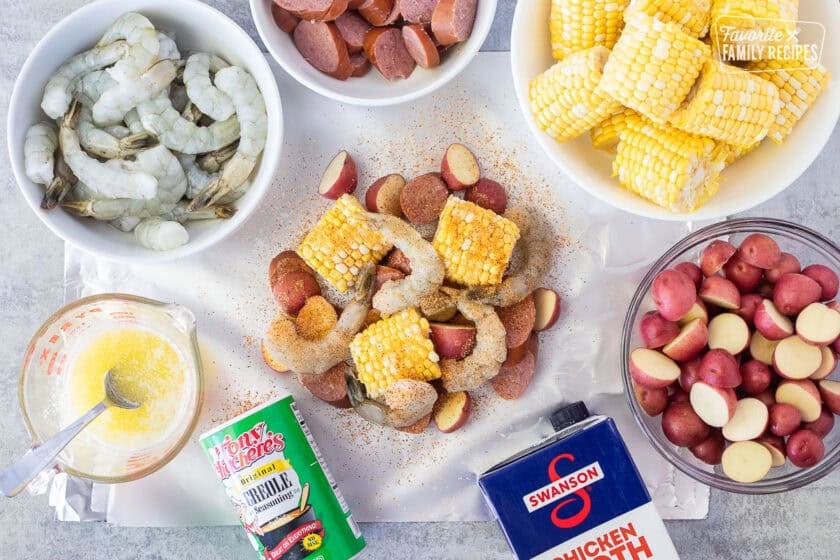Foil with beef sausage, corn, shrimp, red potatoes in the middle and seasoned.