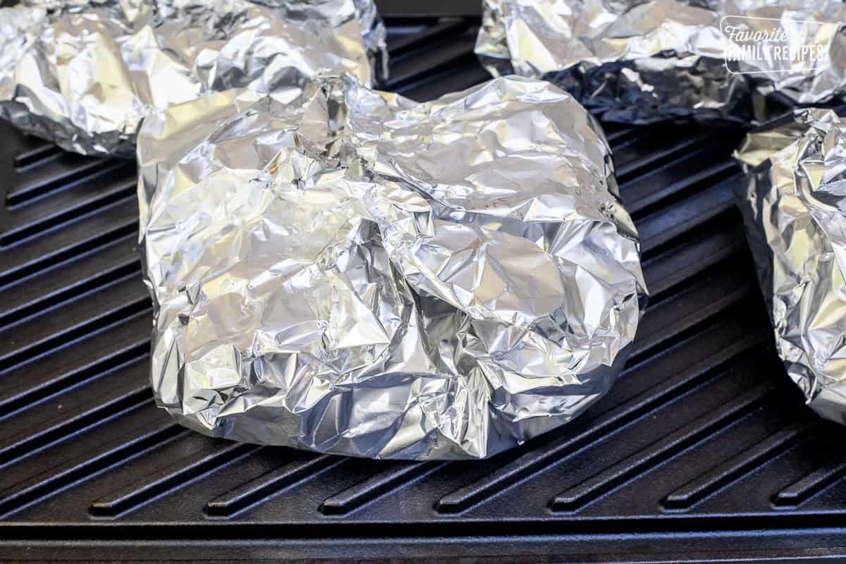 Cajun Foil Packets on grill top.