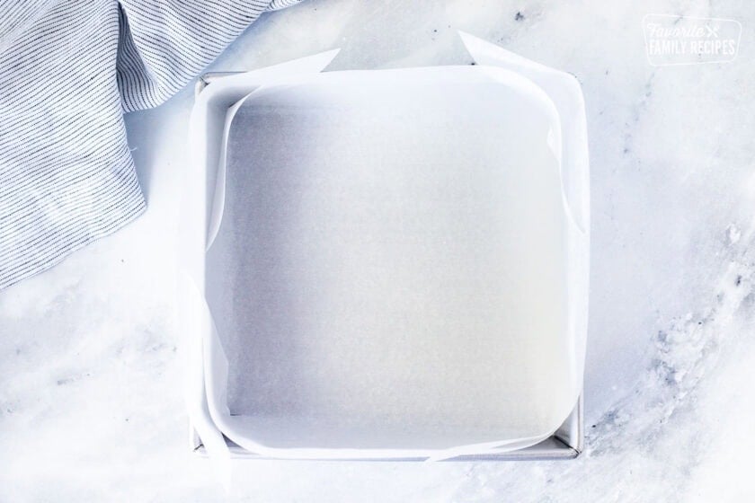 Square pan lined with parchment paper.