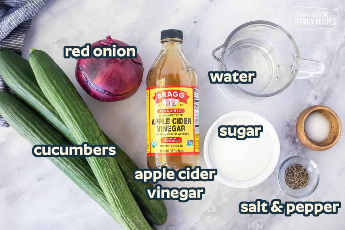 Ingredients to make Cucumber Vinegar Salad including cucumbers, salt and pepper, apple cider vinegar, sugar, red onion, and water.
